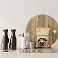 Round Wooden Cutting Board With Black White Clear Spice Bottles And Coffee Woven Bag