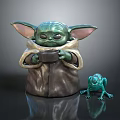 Green Character Figurine With Large Ears Brown Cloak Holding Small Object And Green Frog Figurine