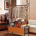 Metal Clothes Rack With Hanging Clothes And Storage Basket In Indoor Setting With Wooden Furniture