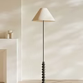 Modern Floor Lamp With Light Colored Shade Black Metal Pole Beaded Base In Minimalist Room