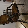 Classic Armchair With Carved Armrests Patterned Fabric Dark Wooden Legs And Gold Accents