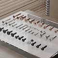 Assorted Metal Hardware Tools Including Screws Bolts And Fasteners On Transparent Display Stand