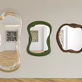 Three Decorative Mirrors With Unique Shaped Frames Hanging On Wall In Interior Room