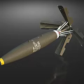 Military Bomb Weapon With Green Body Yellow Tip And Deployable Metal Tail Fins