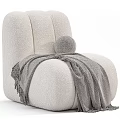 Cozy Cream Textured Single Sofa With Grey Blanket And Small Round Pillow