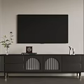 Modern Black TV Stand With Decorative Vase Photo Frame And Speakers In Living Room