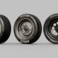 Car Tires from Different Brands with Various Wheel Designs Displayed in Studio