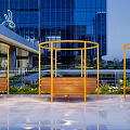 Modern Landscape Seats With Wooden Seats Yellow Metal Frames And Surrounding Greenery