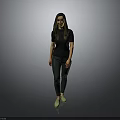 Woman in Black Top and Dark Pants with Green Shoes Standing Against Gray Background