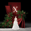 Floral Installation with Red Curtain White X Red Berries Green Foliage and White Wedding Dress