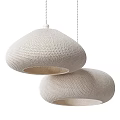 Two Beige Knitted Dome Pendant Lights With Warm Glow For Modern Interior Spaces