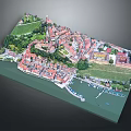 Aerial View of Charming Town With Red Rooftops Green Meadows and Waterfront Moored Boats