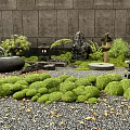 Tranquil Japanese Courtyard Garden With Lush Greenery Stone Lanterns Rock Features And Gravel Ground