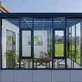 Villa Balcony Glass Sunroom with Black Frame Table Chairs and Green Lawn View
