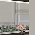 White Roller Blinds on Window with City View Green Plants and Pink Flowers