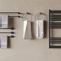 Soft Striped Gray White Towels Hanging On Black Towel Racks And Rings Against Beige Wall