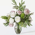 Elegant Floral Arrangement In Clear Glass Vase With White Roses Pink Blooms And Green Foliage