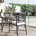 Modern Restaurant Interior With Wooden Walls Glass Panels Dining Table Chairs And Pendant Lights