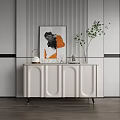 Modern Entryway Console Cabinet With White Curved Design Gold Legs Green Plant And Artwork