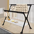 Sturdy Black Metal Clothes Rack With Hanging Clothes Quilt And Lower Storage Shelf