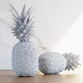 Two Pineapples One Standing and One Lying on Wooden Table with Marble Background and Sunlight
