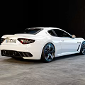 White Maserati Sports Car With Sleek Exterior Design And Alloy Wheels
