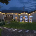 Guesthouse Building Exterior At Night With Deer Shaped Lights Green Lawn And Pathway