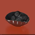 Ceramic Shell Shaped Bowl With Silver Finish Holding Black Round Objects On Red Background 3d model