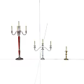 Different Style Candle Holders With Tall Red And Small Metal Stands