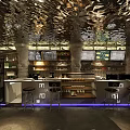 Cave Style Cafe Interior With Stone Walls Illuminated Lighting And Wooden Menu Boards