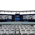 Modern Conference Hall Setup With White Chairs Stage Screen And Blue Lighting