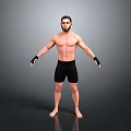 Shirtless Man in Black Shorts with Wrist Wraps Standing on Grey Background