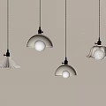 White Pendant Lights With Various Designs Hanging On White Wall