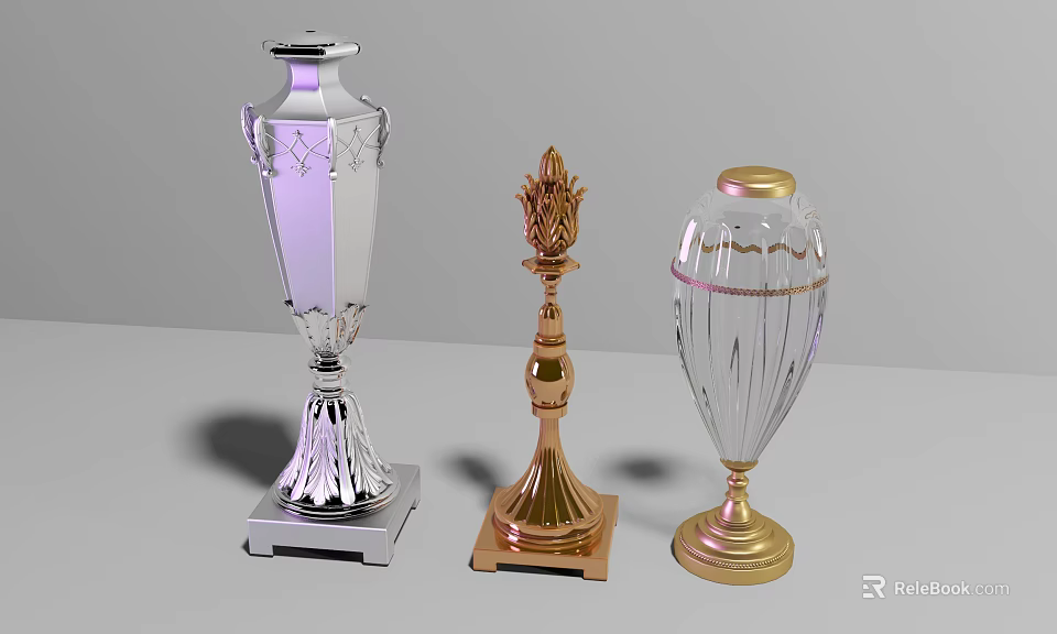 Three Different Designed Trophies With Silver Gold Transparent Bodies And Decorative Bases 3d model 