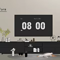 Modern Black TV Stand with Green Plants Books and Decorative Items in Living Room