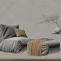 Cozy Gray Bean Bag Chair With Ottoman Blanket Side Table Vase And Dried Branches