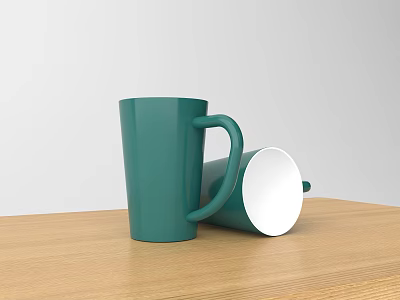 Green Ceramic Mugs One Standing One Toppled On Wooden Table With White Background 3d model