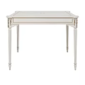Elegant White Square Dining Table With Carved Legs And Ornate Design Details
