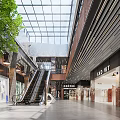 Modern Shopping Mall Retail Stores With Glass Skylight Escalator Green Plants And Spacious Corridor