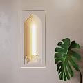 Modern Arched Wall Lamp With Warm Light On Light Wall Near Green Leaf Plant