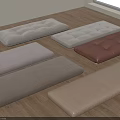 Assorted Floor Cushions In Neutral Tones With Fabric And Leather Textures On Wooden Floor