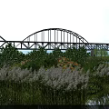 Scenic Natural Landscape With Arch Bridge Lush Green Vegetation Calm Water And Blue Sky