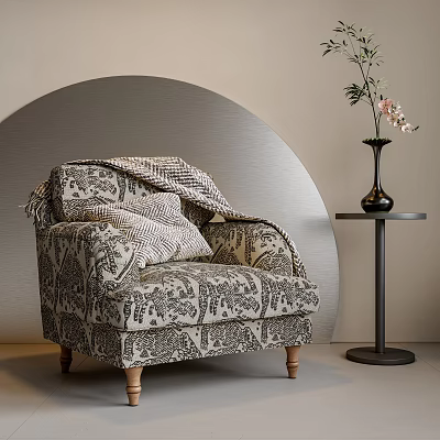 Patterned Fabric Armchair with Blanket and Pillows beside Small Round Table Black Vase Curved Wall 3d model