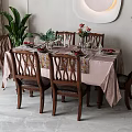 Elegant Dining Table Set With Wooden Chairs Pink Tablecloth And Flower Arrangement