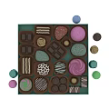 Delicious Colorful Assorted Chocolates With Various Decorations Arranged In Green Box