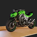 Green And Silver Modern Sport Motorcycle With Black Seat Accent Wheels On Display Stand