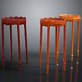 Three Red and Orange Garden Decorative Pedestal Tables with Scalloped Tops and Slender Legs