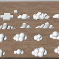 White Cloud Shaped Objects Arranged Neatly On Wooden Floor Surface 3d model