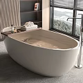 Modern Oval Bathtub In Bathroom With Floor Mounted Faucet And Scenic View
