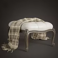 Luxurious White Leather Sofa Stool With Plaid Blanket And Carved Wooden Legs